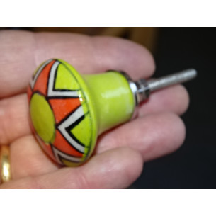 pastel green pear-shaped button and orange flower