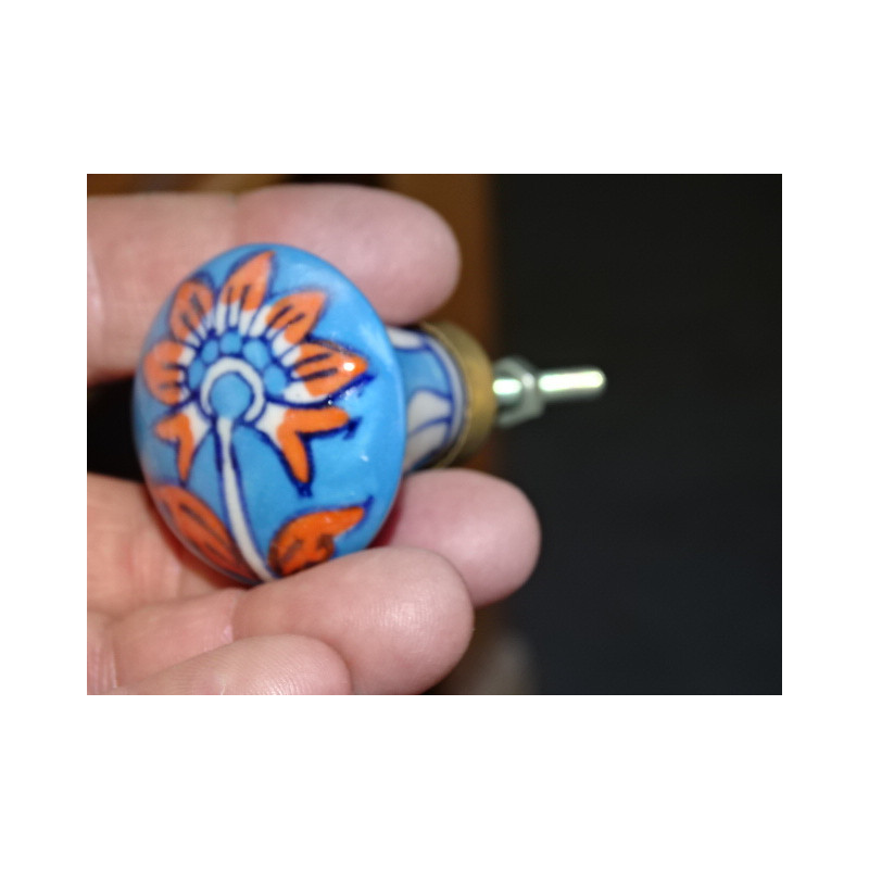 turquoise pear shaped button and orange flower