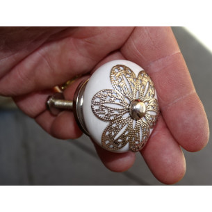 White porcelain handle with daisy metal ornament
