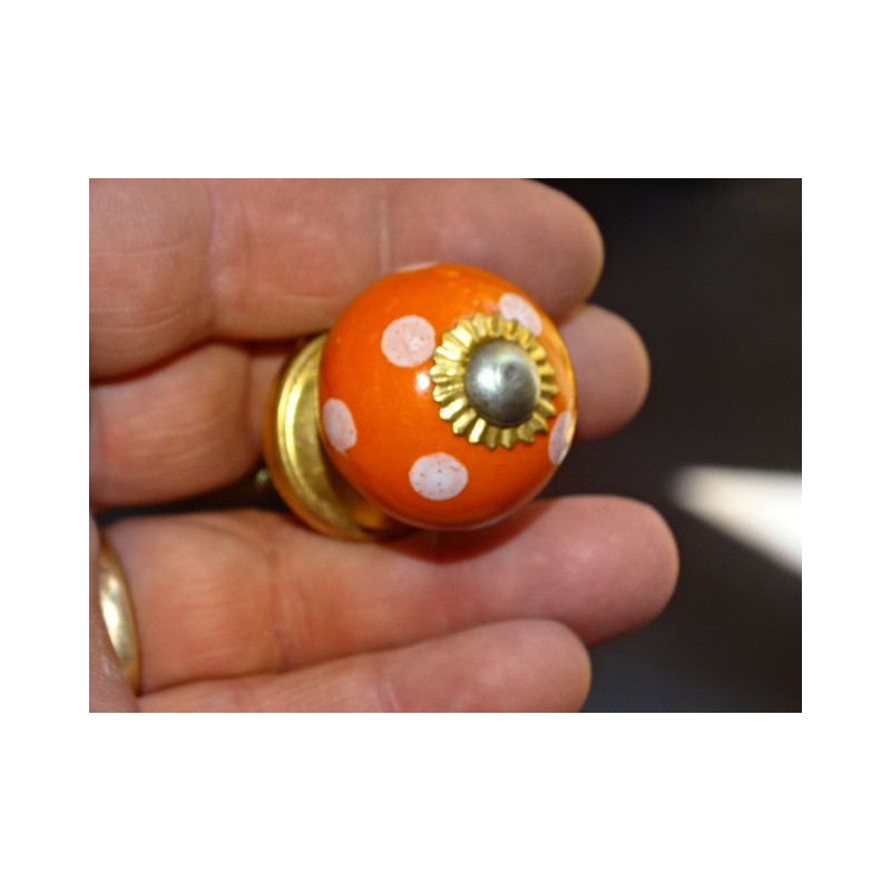 Small orange handles with white dots