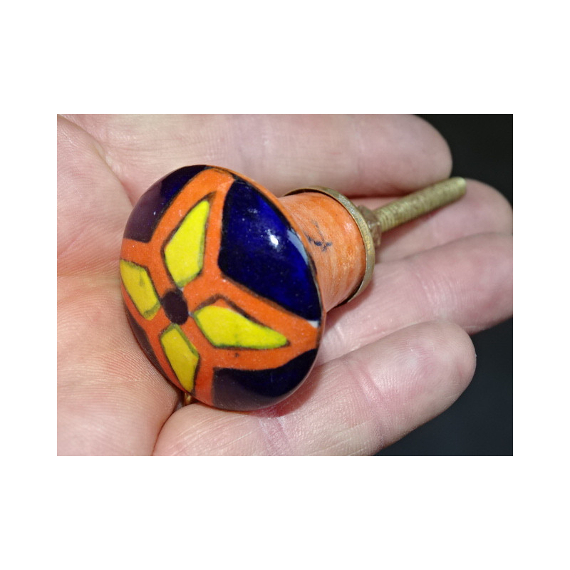 orange pear shaped button and yellow and ultramarine flower